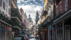 View up one way street in downtown New Orleans, Louisiana, USA in the French quarter